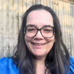 A photo of Liz with a blue top on.